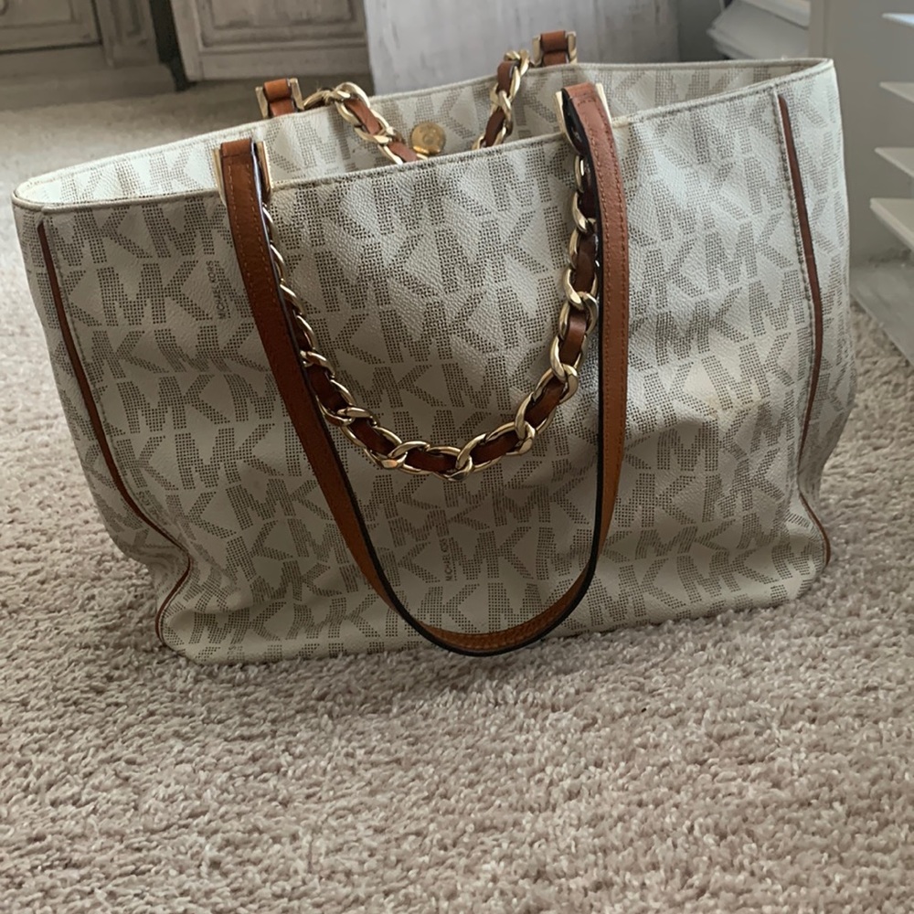 Purse is in good condition. No outside pockets. Gold MK plate